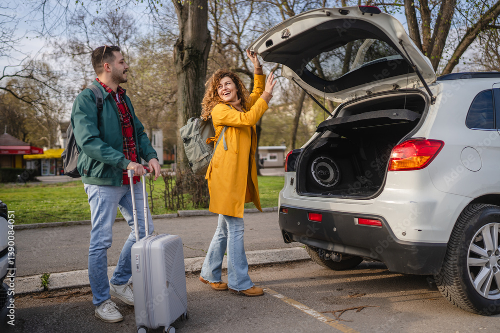 happy couple loading luggage baggage into car trunk, ready for trip happy couple loading luggage baggage into car trunk, ready for trip