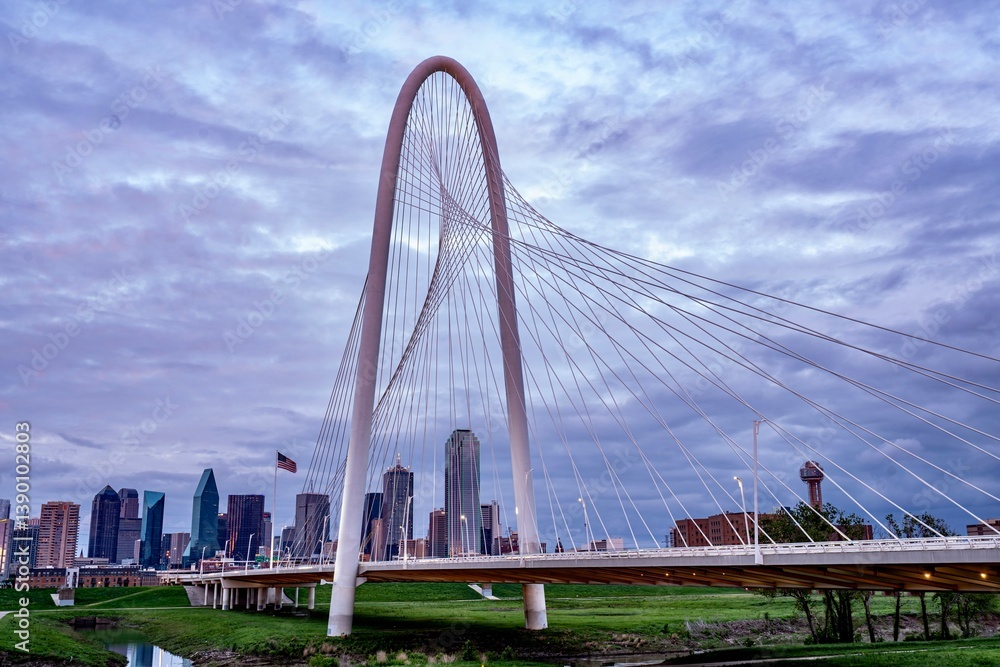 Downtown Dallas, TX behind the Margaret Hunt Bridge at Dusk