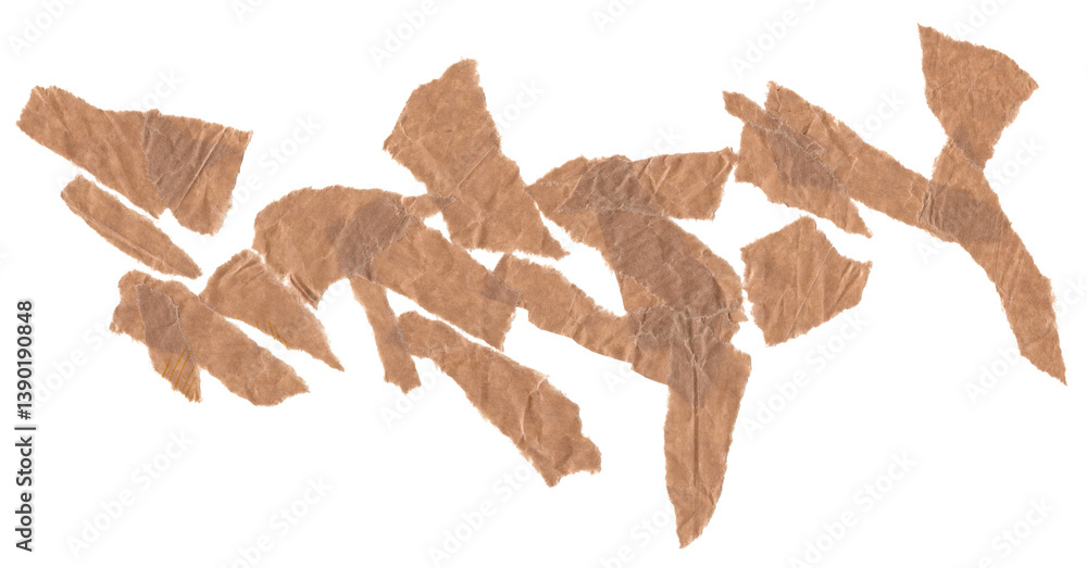 Fototapeta premium Torn brown paper scraps randomly scattered on transparent background. Rough texture and natural irregular edges