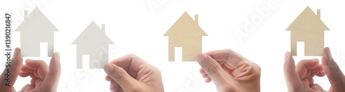 Home ownership journey hands displaying paper houses minimalist style indoor environment conceptual viewpoint