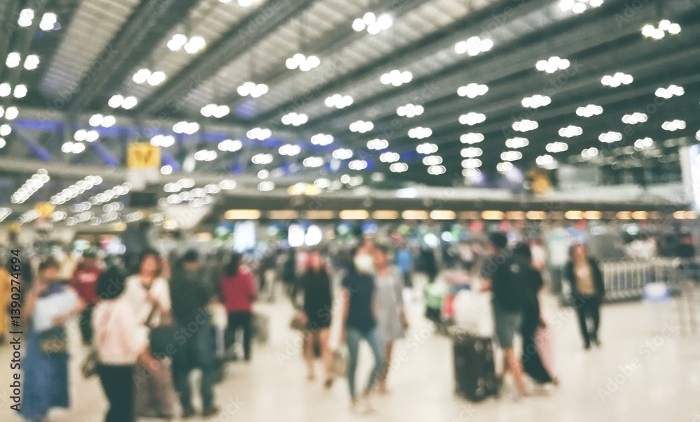 Defocus Blurry passengers people of crowd anonymous walking at the airport. scene of airport with passengers activity. Terminal Departure Check-in at airport. Travel International concept. Defocus Blurry passengers people of crowd anonymous walking at the airport. scene of airport with passengers activity. Terminal Departure Check-in at airport. Travel International concept.