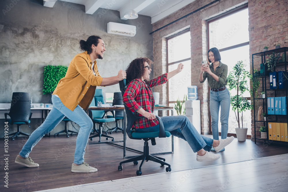 Young diverse colleagues enjoying teamwork with laughter in a modern open workspace Young diverse colleagues enjoying teamwork with laughter in a modern open workspace