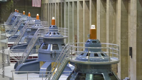 Large power generators operate within the Hoover Dam, illustrating the impressive engineering and infrastructure that harnesses hydroelectric power in the US.