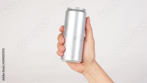 Hand is hold A blank silver aluminum can on white background.