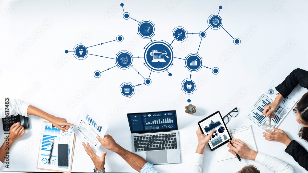 A vibrant modern office setup illustrating teamwork with multiple devices displaying business analytics and collaborative strategies, ideal for concepts of innovation and productivity. Amity