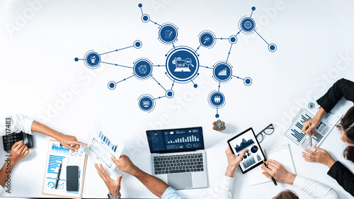 Obraz na płótnie A vibrant modern office setup illustrating teamwork with multiple devices displaying business analytics and collaborative strategies, ideal for concepts of innovation and productivity. Amity w salonie
