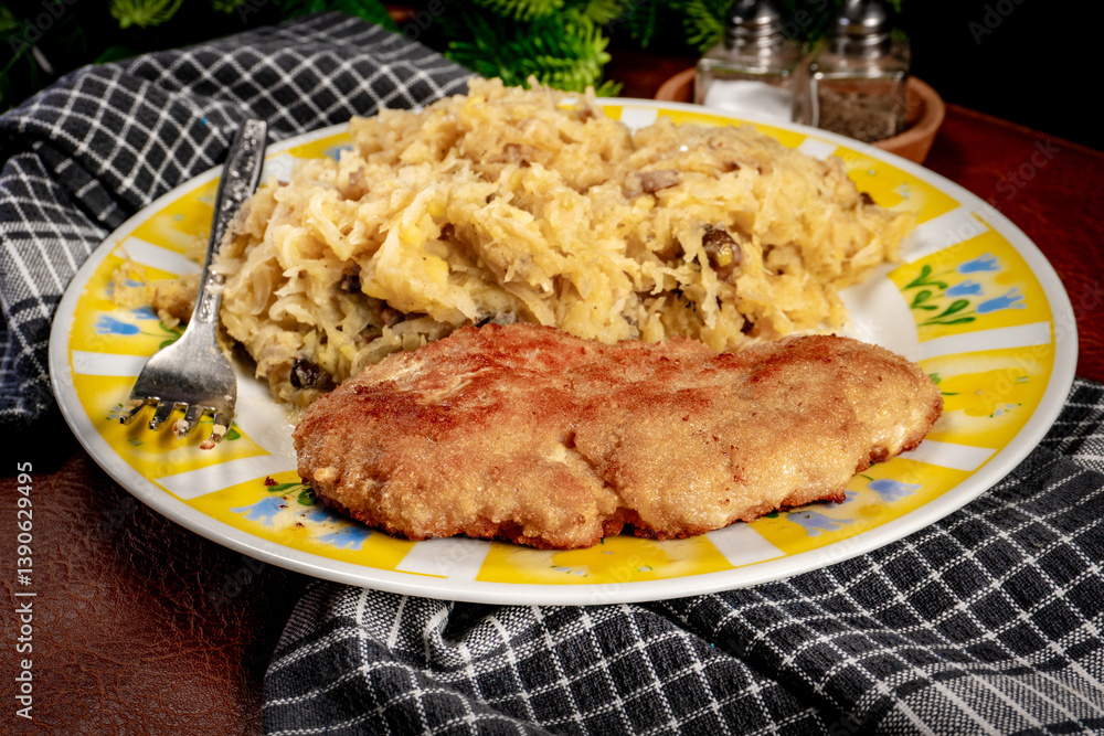 Minced meat cutlet with boiled sauerkraut.