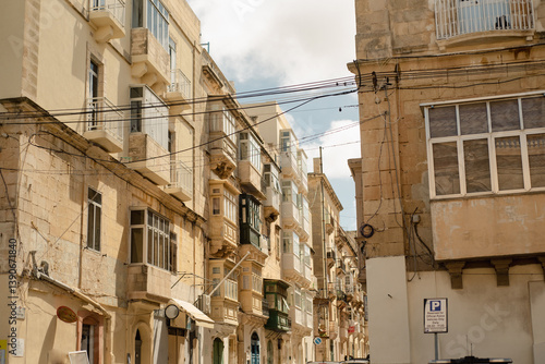 Fototapeta Naklejka Na Ścianę i Meble -  Everyday Malta: Authentic residential streets, houses with balconies, cityscape and local architecture