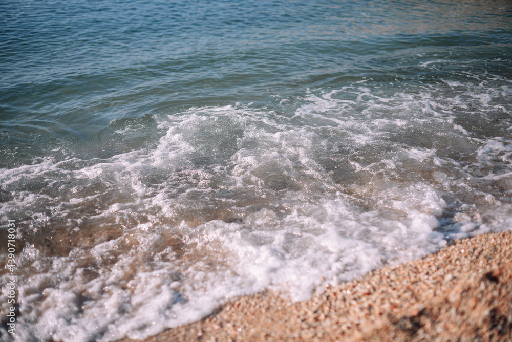 sea waves, foam on a sandy beach, close sea waves, foam on a sandy beach, close