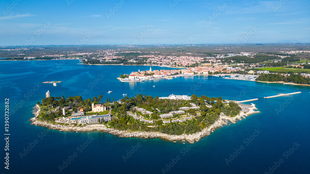 Obraz premium Aerial view of Poreč (Porec), Croatia, showcasing the charming old town, vibrant coastline, and the nearby island of Sveti Nikola. The stunning Zelena Laguna area adds to the beauty turquoise waters