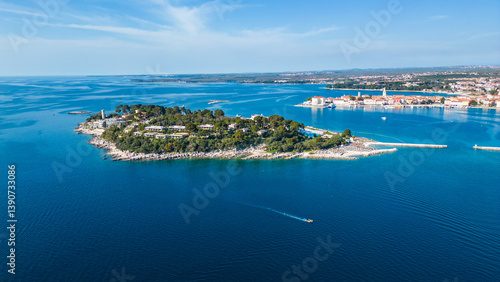 Aerial view of Poreč (Porec), Croatia, showcasing the charming old town, vibrant coastline, and the nearby island of Sveti Nikola. The stunning Zelena Laguna area adds to the beauty turquoise waters