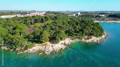 Aerial view of Poreč (Porec), Croatia, showcasing the charming old town, vibrant coastline, and the nearby island of Sveti Nikola. The stunning Zelena Laguna area adds to the beauty turquoise waters