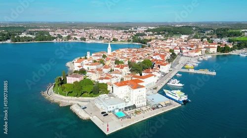 Aerial view of Poreč (Porec), Croatia, showcasing the charming old town, vibrant coastline, and the nearby island of Sveti Nikola. The stunning Zelena Laguna area adds to the beauty turquoise waters