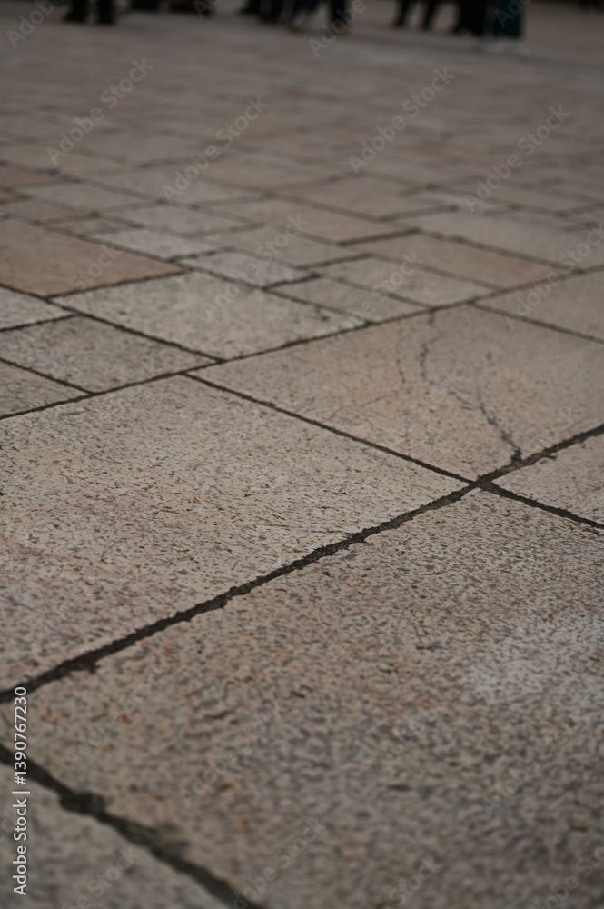 Fototapeta premium grey paving tile texture, grey tile pattern as background, grey tile texture close up