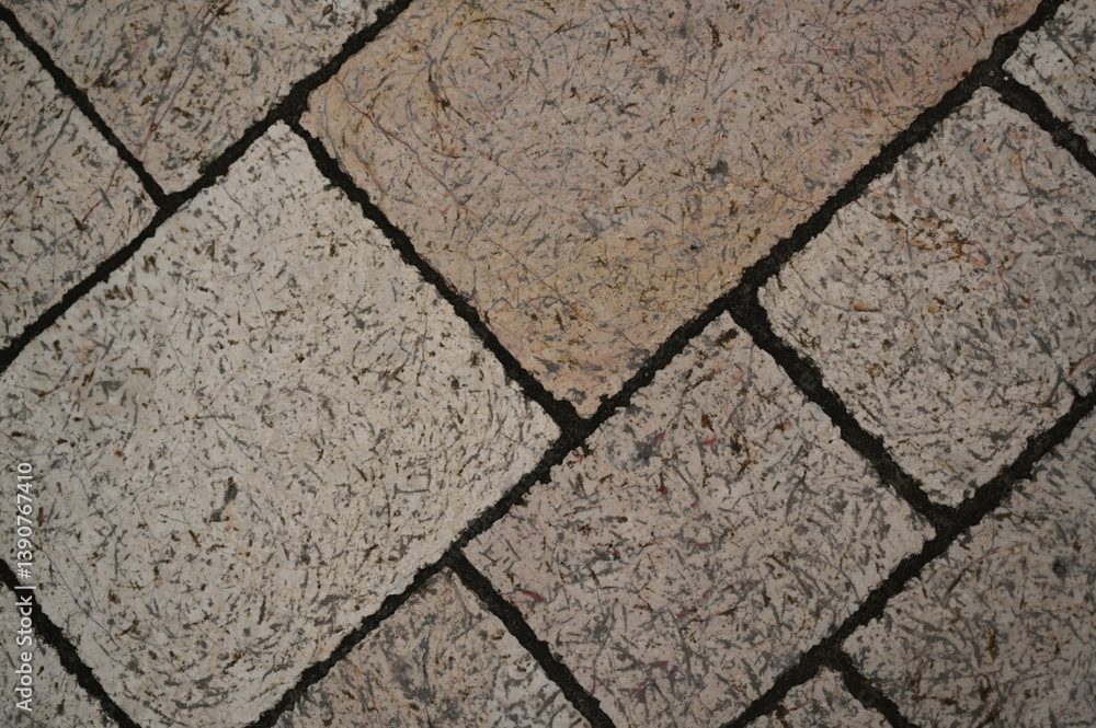 Fototapeta premium grey paving tile texture, grey tile pattern as background, grey tile texture close up 