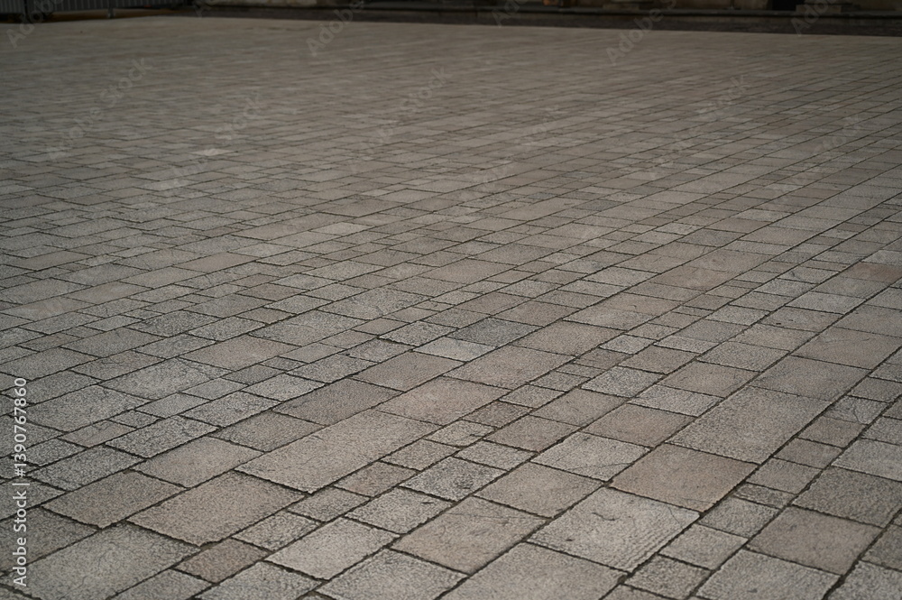 Fototapeta premium grey paving tile texture, grey tile pattern as background, grey tile texture close up 