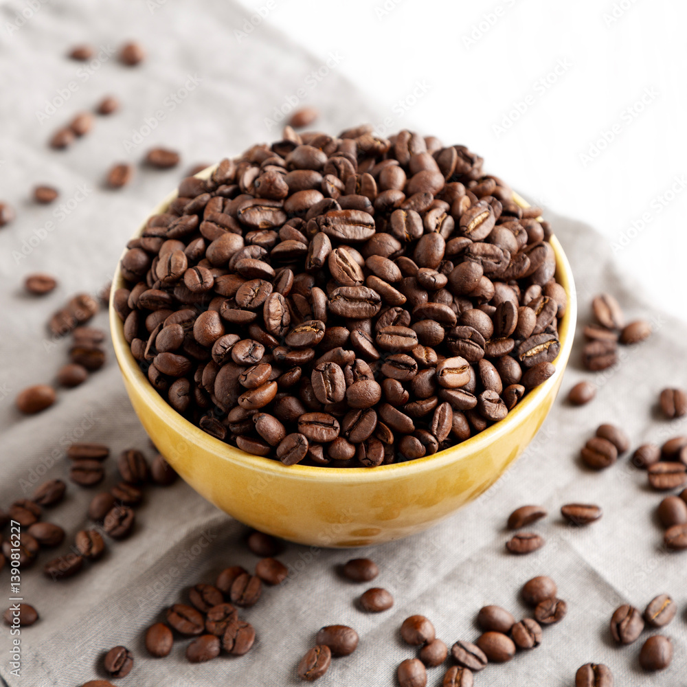 Fototapeta premium Organic Roasted Coffee Beans in a Bowl, side view.