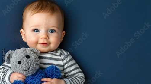 Smiling baby with toy home portrait indoor close-up joyful expression