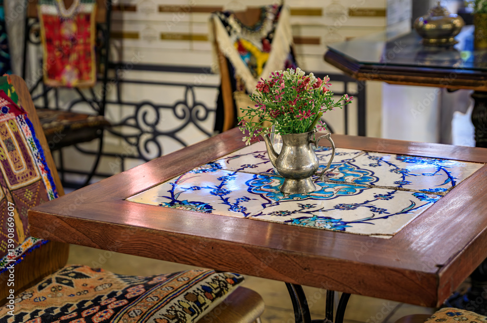 Mosaic tiled restaurant table with flowers at Grand Bazaar in Istanbul, Turkey