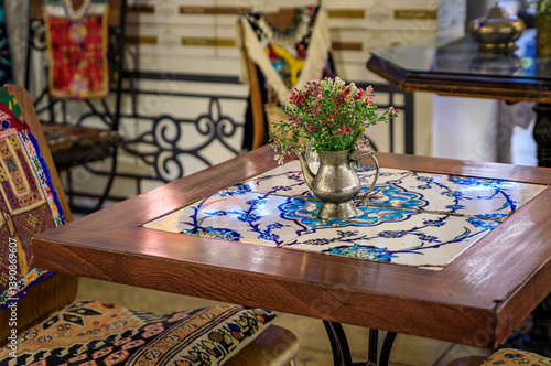 Obraz na płótnie Mosaic tiled restaurant table with flowers at Grand Bazaar in Istanbul, Turkey w salonie