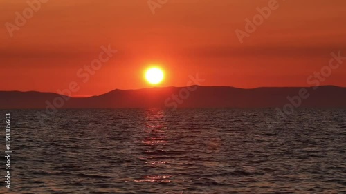 Beautiful, summer, warm sunset on Lake Baikal. Taken from the deck of the ship. Vacation, recreation, tourism.