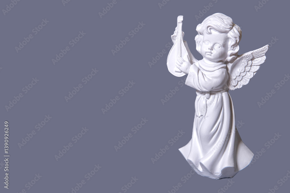 Naklejka premium Figurine of an angel on a white background.