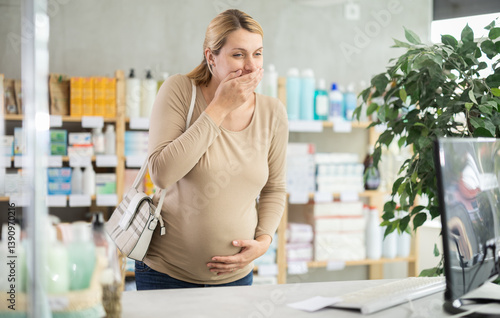 Pregnant female customer feeling sick and vomiting while being in chemist's shop