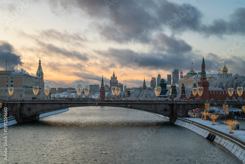 Grand Kremlin Palace, Beklemishevskaya Tower and the ensemble of the Kremlin Cathedral Square against the backdrop of the Bolshoy Moskvoretsky Bridge over the Moskva River, Moscow, Russia