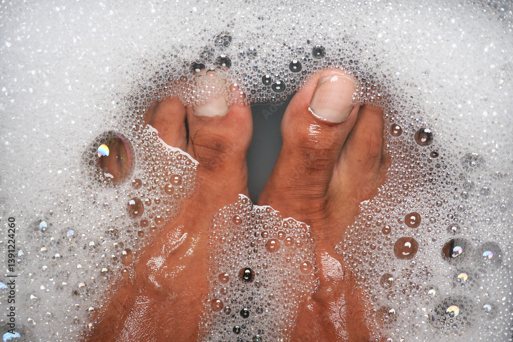 Relaxing moment in warm bubble bath with clean feet Relaxing moment in warm bubble bath with clean feet
