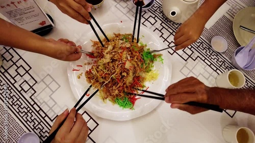 Hand mixing Yee Sang, Chinese New Year Foods