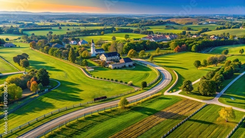 Aerial view of Lexington Kentucky on a clear sunny day with rolling hills and horse farms in the background
