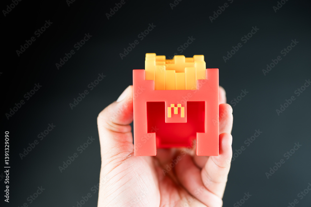 Fototapeta premium Bangkok, Thailand - April 8, 2025 : Fry Helmet Minecraft from McDonald, Toy form Minecraft blind box from McDonald's collaborates Minecraft the movice