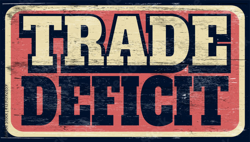 Aged vintage trade deficit sign on wood