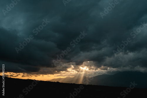 Wallpaper Mural Dark stormy sky with sun rays breaking through, perfect for dramatic backgrounds, weatherthemed designs, and expressing hope during difficult times. Torontodigital.ca