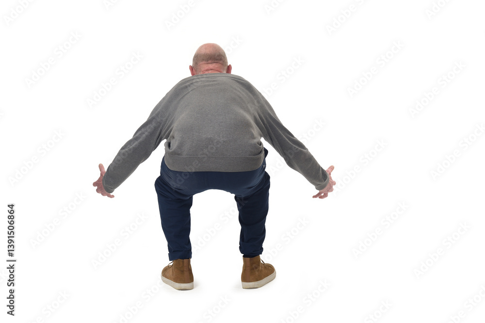 back view of a man lifting something heavy from the ground on white background back view of a man lifting something heavy from the ground on white background