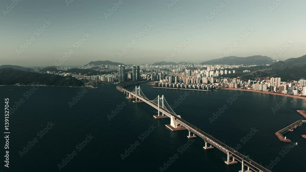 Drone view of morning traffic on Gwangan suspension bridge in Busan, South Korea