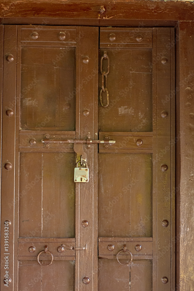 Traditional Wooden Door of Bhunga Hut with Decorative Artwork in Rann of Kutch