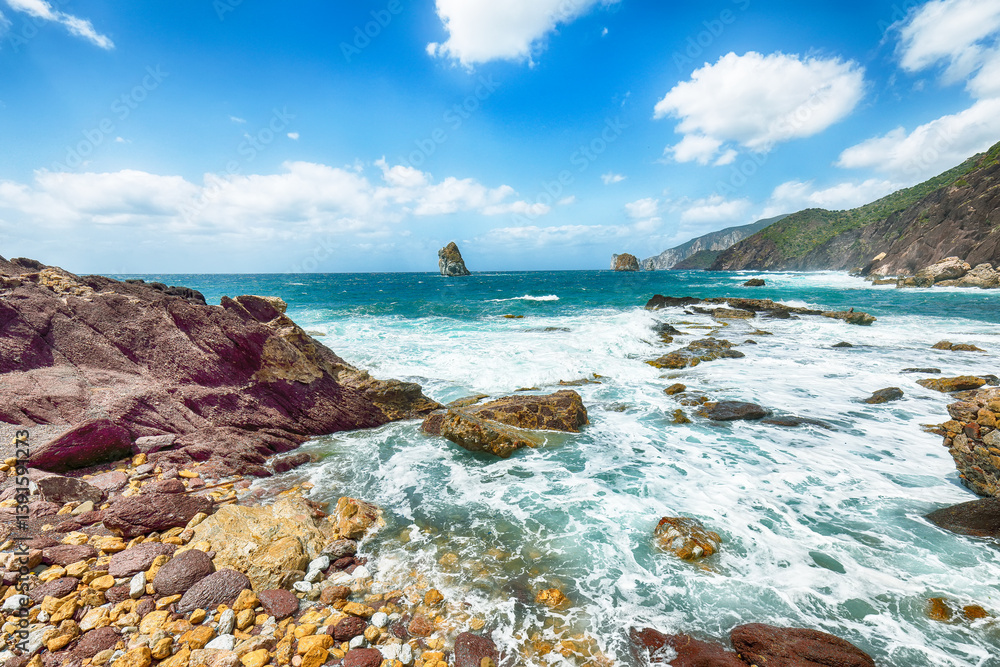 Unbelivable spring view of Nebida and Masua coast and Pan Di Zucchero on background.