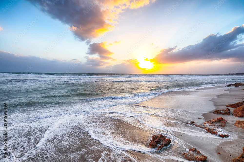 Unbelivable view of sunset on beach Capo San Marco Oristano on Del Sinis peninsula.