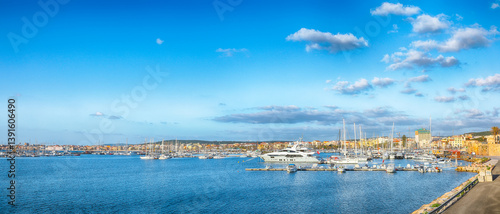 Obraz na płótnie Unbelivable summer view of the Alghero Marina yacht port at the Gulf of Alghero with anchored sailboats. w salonie