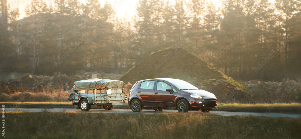 Compact family vehicle with covered trailer driving