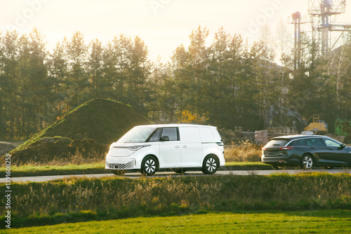 White SUV electric car traveling outdoors