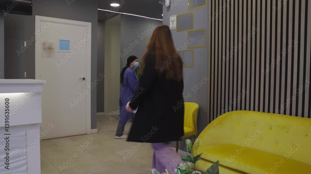 Patient entering dental office following nurse instructions