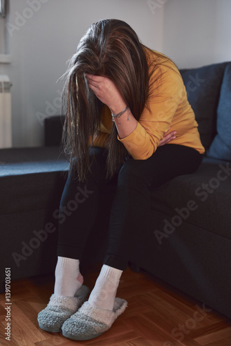 Woman with strong stomach ache, menstrual and digestive issues at home.