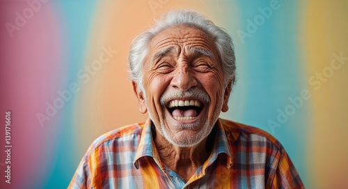 latin Hispanic elderly man on colorful plain bright background happy laughing hysterical looking at camera portrait banner with copy space ad concept marketing