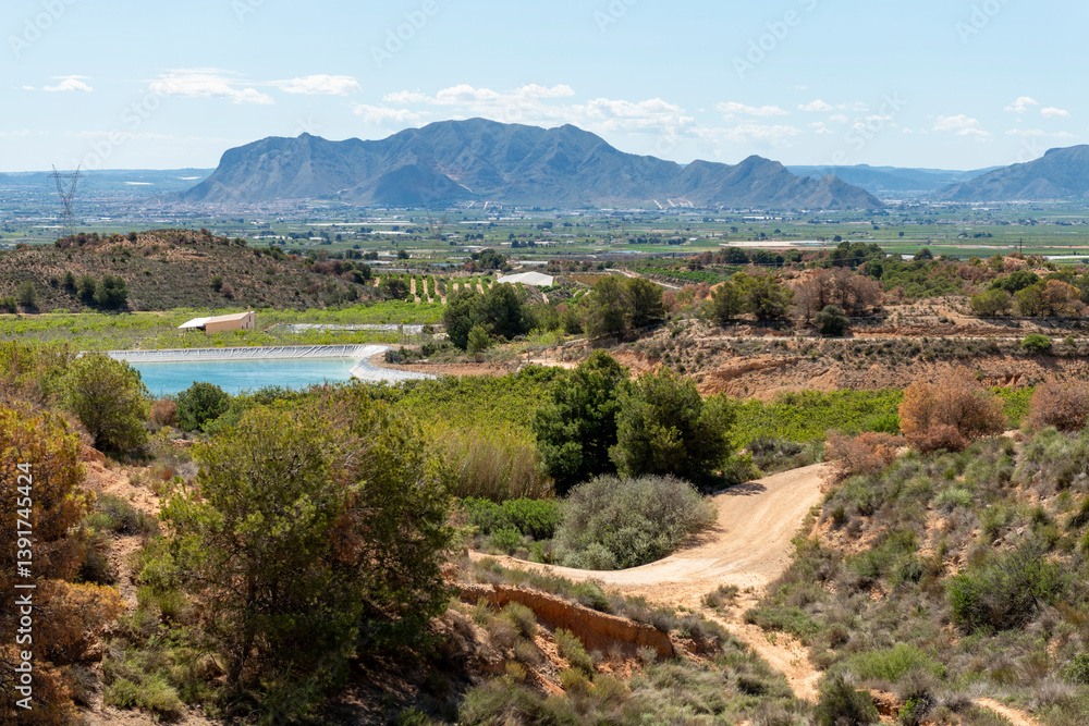 Fototapeta premium Beautiful scenery with winding gravel dirt road, Costa Blanca , Alicante, Spain - stock photo