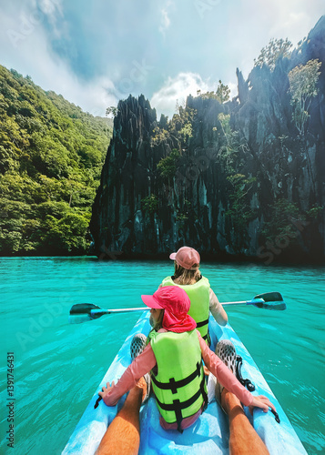 Family summer vacations kayaking in Philippines travel healthy lifestyle active trip, parents and child exploring Palawan island turquoise water lagoon tropical vibes