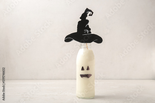 Bottle of milk and hat made...