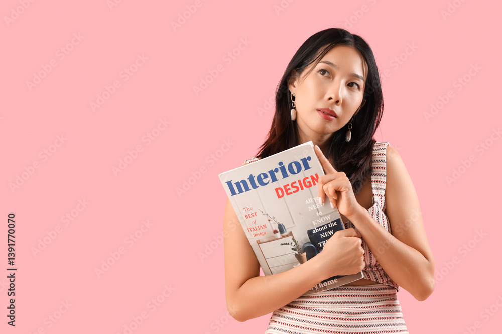 Thoughtful young beautiful Asian woman with magazine on pink background Thoughtful young beautiful Asian woman with magazine on pink background