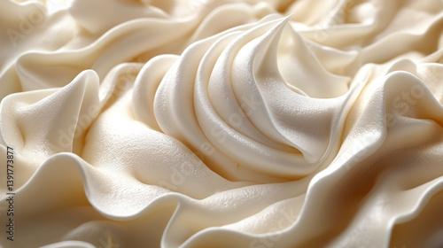 An exquisite close-up of soft, creamy frosting with delicate swirls and peaks, offering a rich, luxurious appearance.